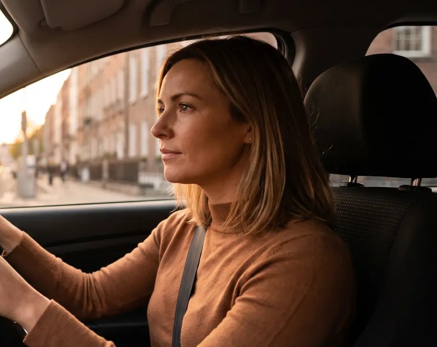 A driver at the wheel on a Dublin street, illustrating Sunshine 106.8 road safety programming